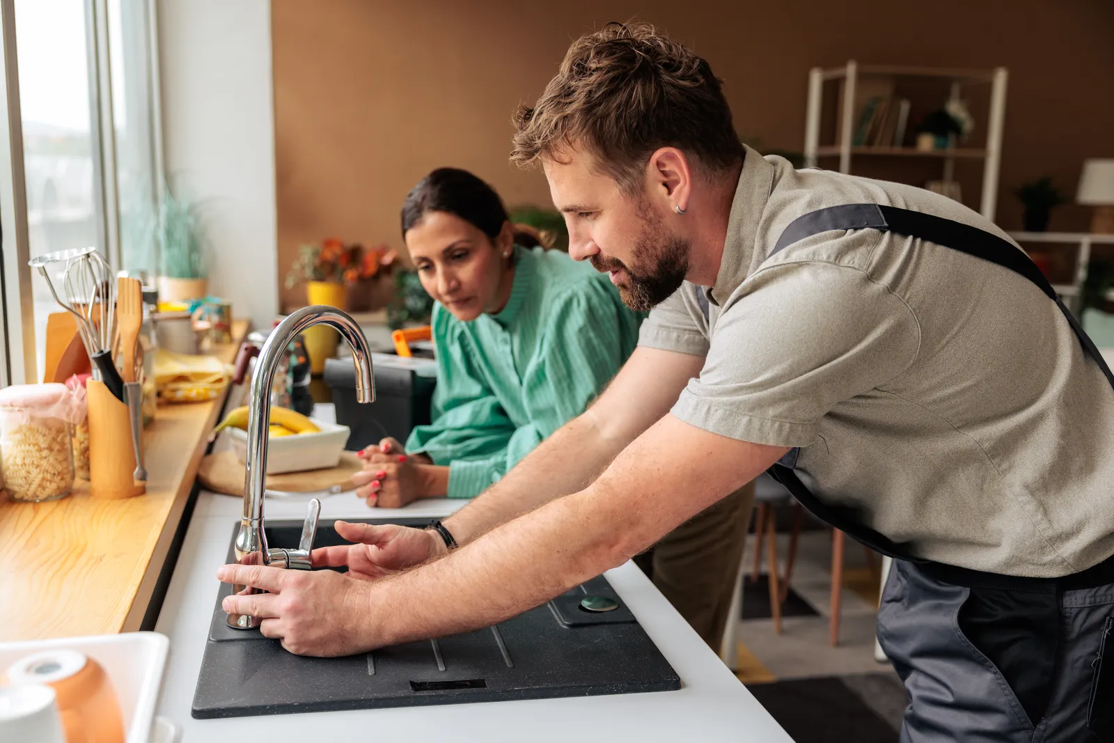 BC Plumbing plumber consulting with a homeowner